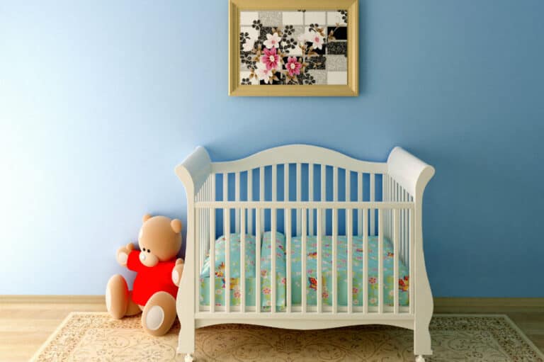 When can you put a blanket in a baby crib